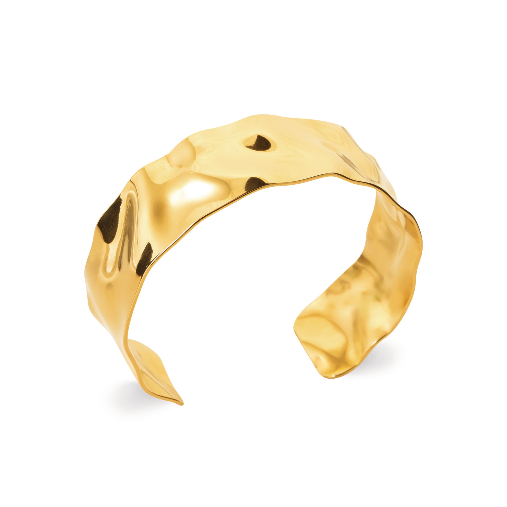 Gold-tone organic cuff bracelet with a fluid sculptural silhouette and polished reflective finish by HNKO