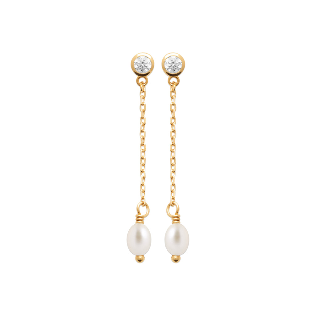 A pair of gold dangle earrings with round clear gemstone studs, delicate gold chains, and white pearl drops, shown on a plain white background.