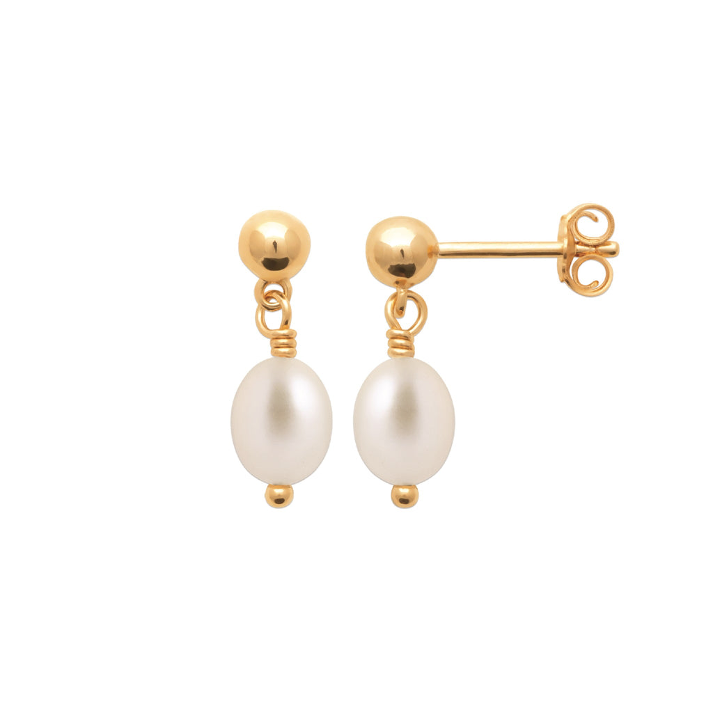 A pair of gold stud earrings with oval white freshwater pearls, shown on a clean white background. One earring is facing forward to show the pearl and post, while the other is turned to the side showing the screw-back post and butterfly clasp.