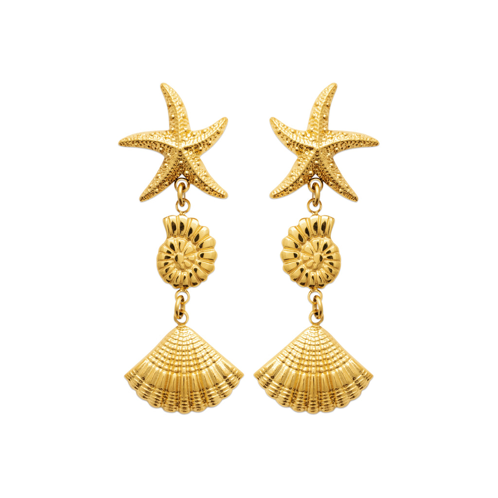 Gold-tone drop earrings featuring starfish, spiral shell and seashell charms inspired by Nordic coastal life by HNKO
