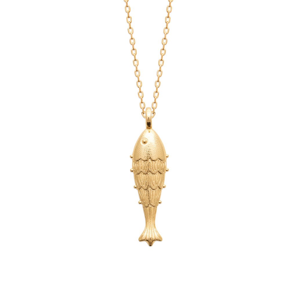 A gold fish-shaped pendant necklace on a delicate gold chain, shown against a plain white background.
