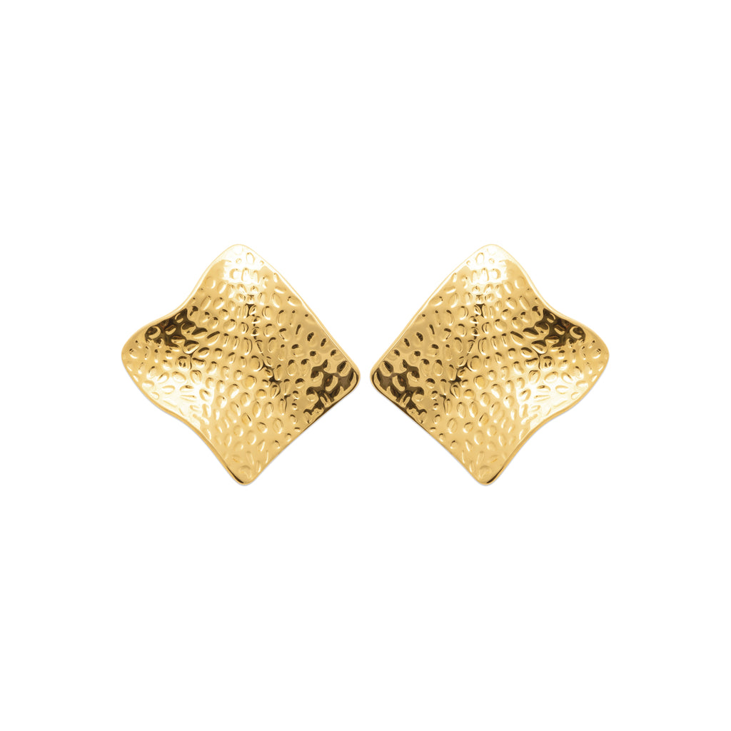 Gold-tone stainless steel statement earrings with a hammered organic texture and sculptural shape inspired by the movement of the sea by HNKO Finland.
